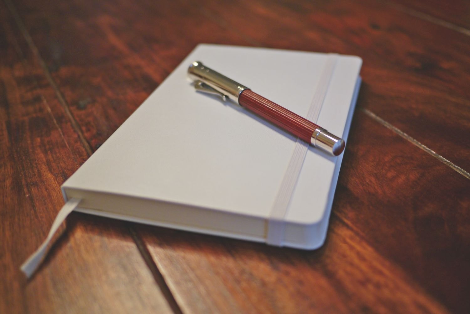 Notebook and pen for observations about a film narrative.