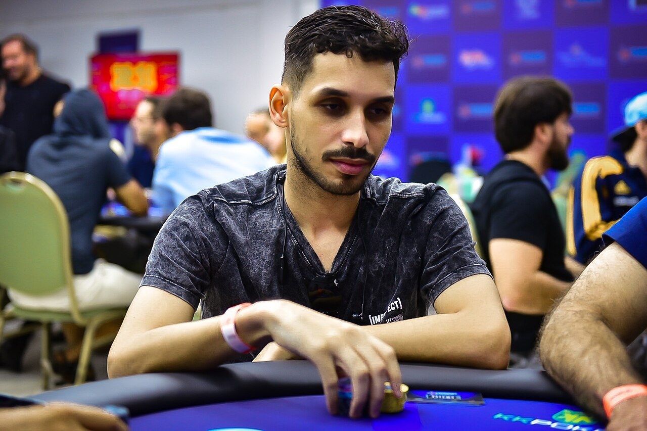 Participant in a poker tournament with face-down cards.