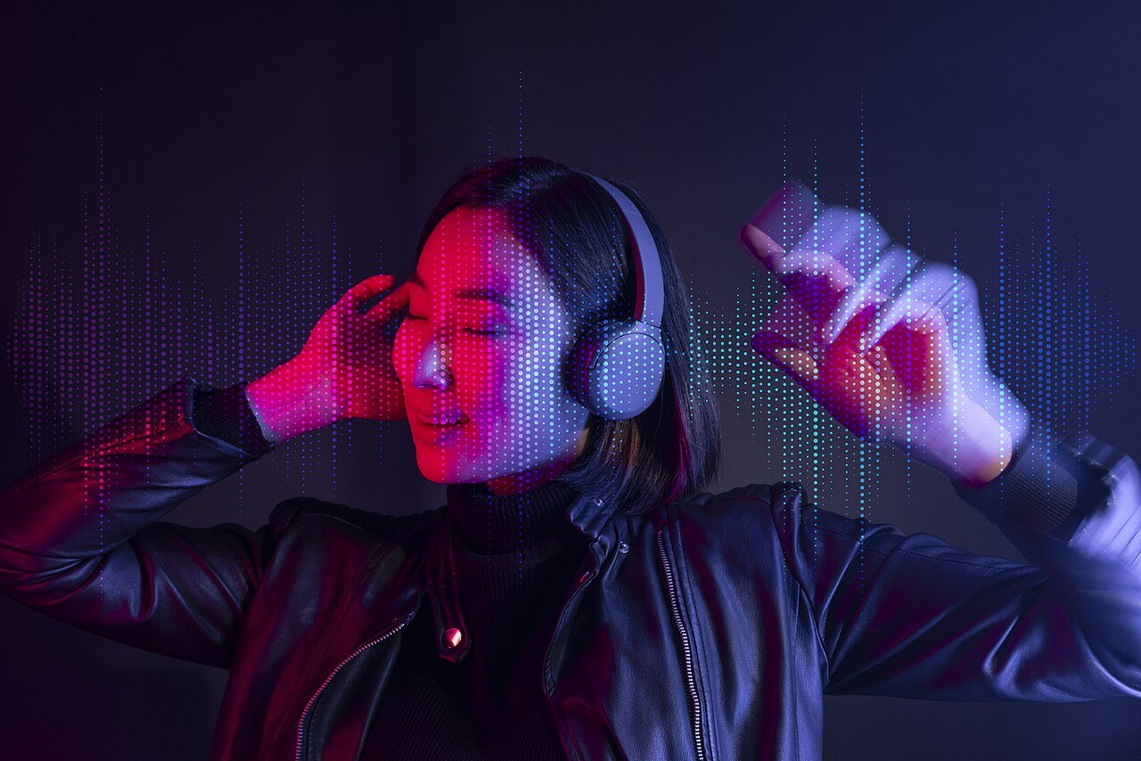 A person listening through wireless headphones.