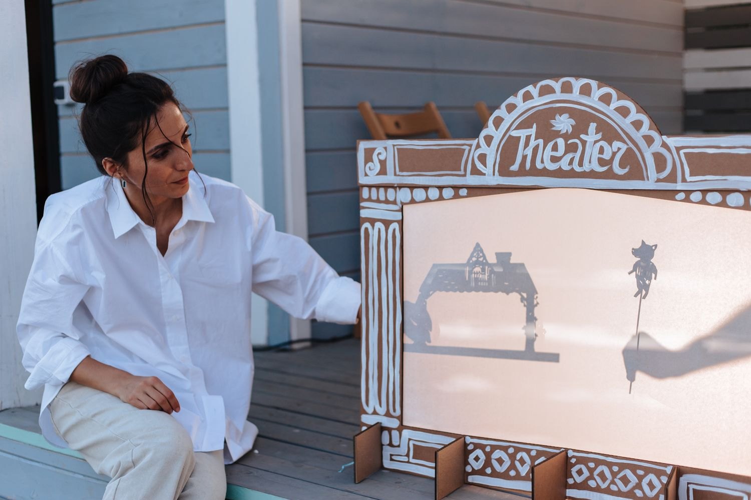 Cut-out figures and scenery in a homemade paper theatre.